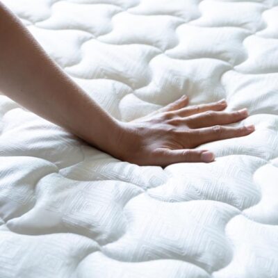 Mattress with a hand pressing